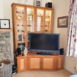 Tv media unit with display in oak and birds eye maple panels