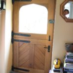 Stable door with cross panels looking from inside