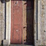 Chapel door with one side part stripped and a burn hole in the lower rail