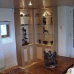 display units in oak and maple burr with glass shelves
