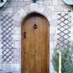 door in distressed oak with arch and ledges from the front