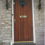 door in mahogany with diamond window
