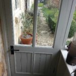door with glass and beaded panels inside