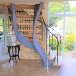 helical staircase with wrought iron handrails under side view