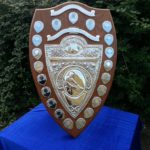 large mahogany shield with silver presentaion plaques